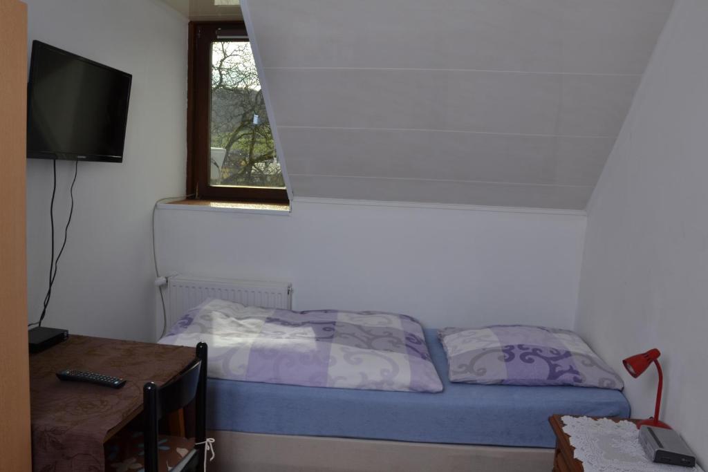 Postel nebo postele na pokoji v ubytování Hotel An der Sauer