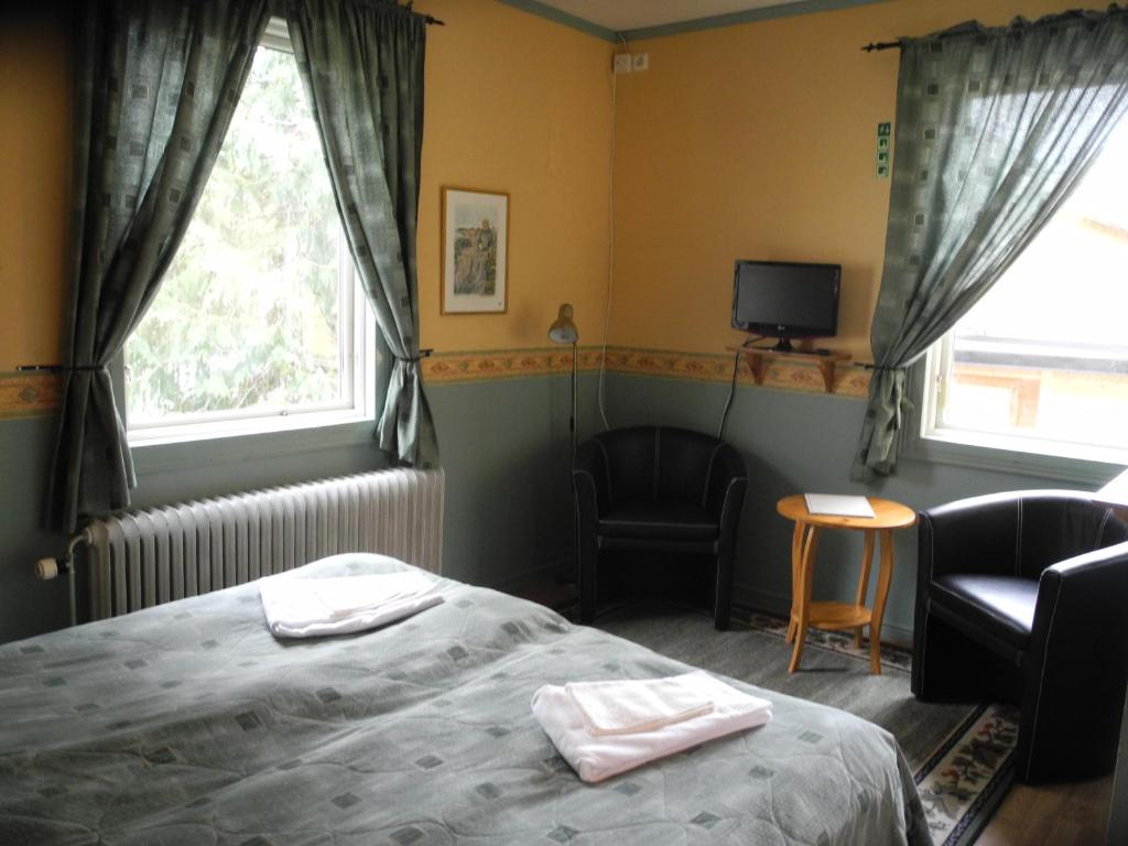 Postel nebo postele na pokoji v ubytování Målilla Hotell & Restaurang