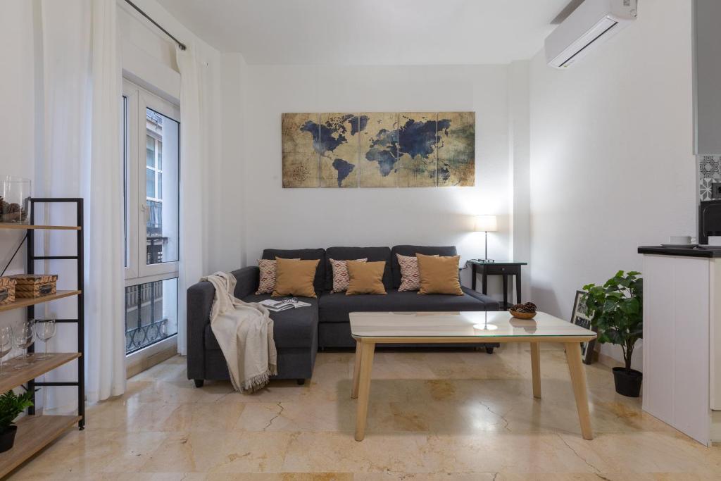 A seating area at Suite Málaga Center
