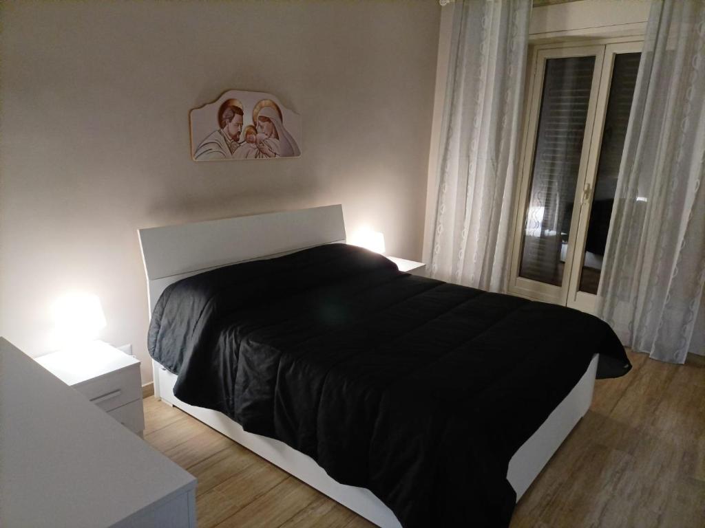 A bed or beds in a room at Tindaro Home