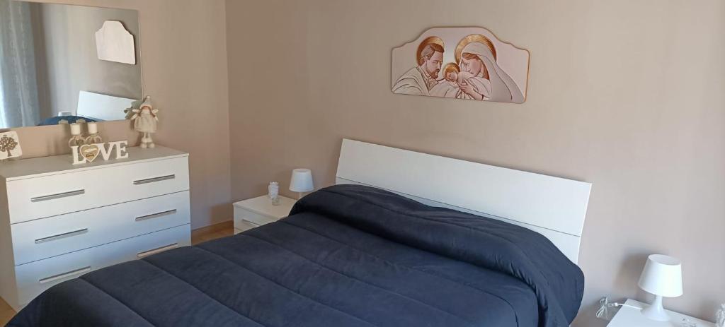 A bed or beds in a room at Tindaro Home