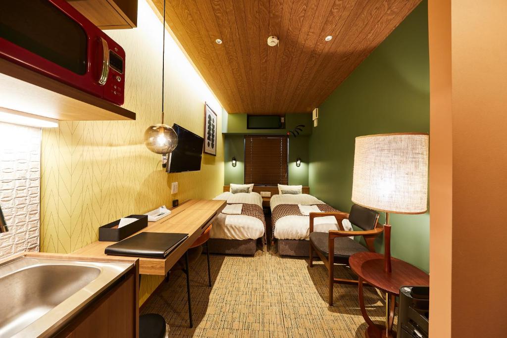 Postel nebo postele na pokoji v ubytování Hotel TORACO konohana