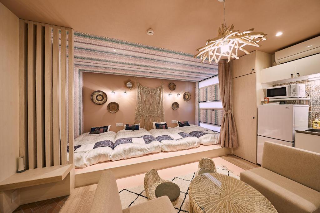 Postel nebo postele na pokoji v ubytování Hotel TORACO konohana