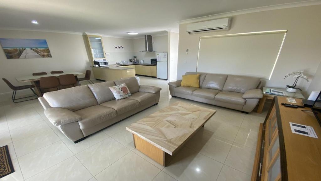 a living room with a couch and a table at Unit 48 Seafront Estate in Jurien Bay