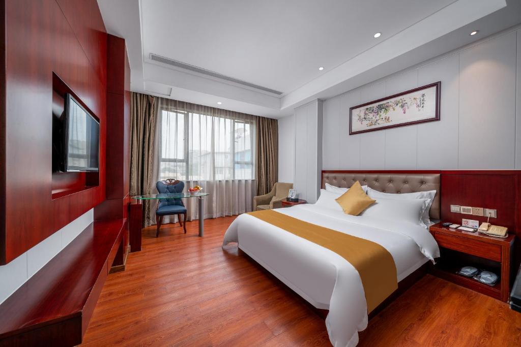 Postel nebo postele na pokoji v ubytování Guangzhou Shi Liu Hotel