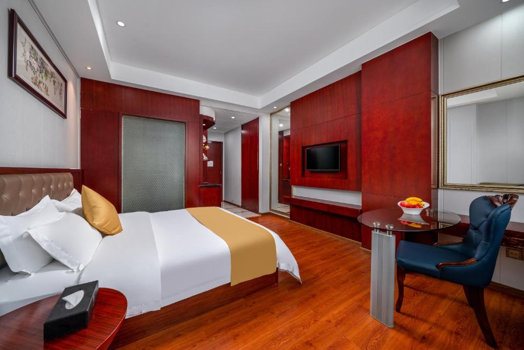 Postel nebo postele na pokoji v ubytování Guangzhou Shi Liu Hotel