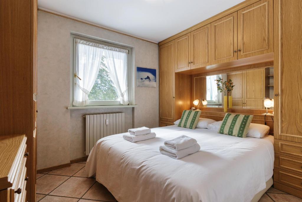Posteľ alebo postele v izbe v ubytovaní Jardins d'Androsace 3ème étage - Happy Rentals