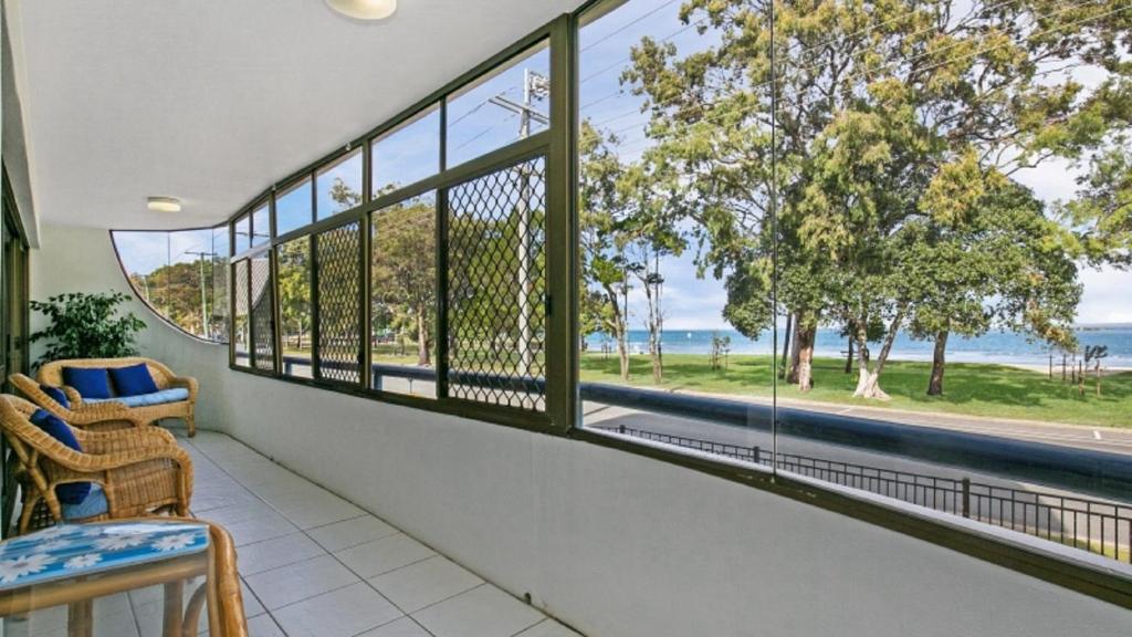 a balcony with a view of the ocean at Views, Pool, Air Conditioning - Karoonda Sands Welsby Pde, Bongaree in Bongaree
