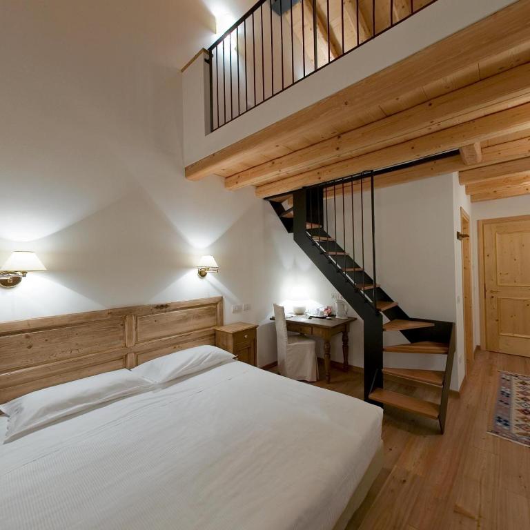 Postel nebo postele na pokoji v ubytování Villa Toderini
