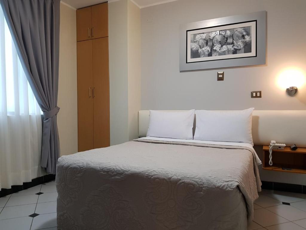 Postel nebo postele na pokoji v ubytování Hotel Punta Rocas - Huacho