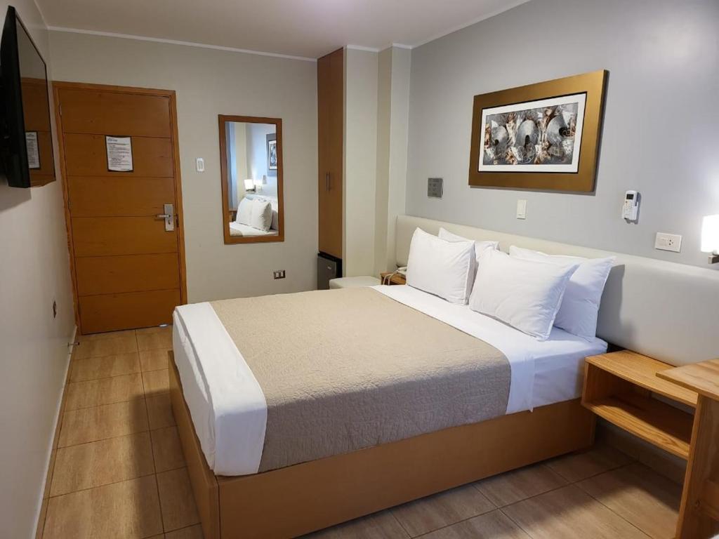 Postel nebo postele na pokoji v ubytování Hotel Punta Rocas - Huacho