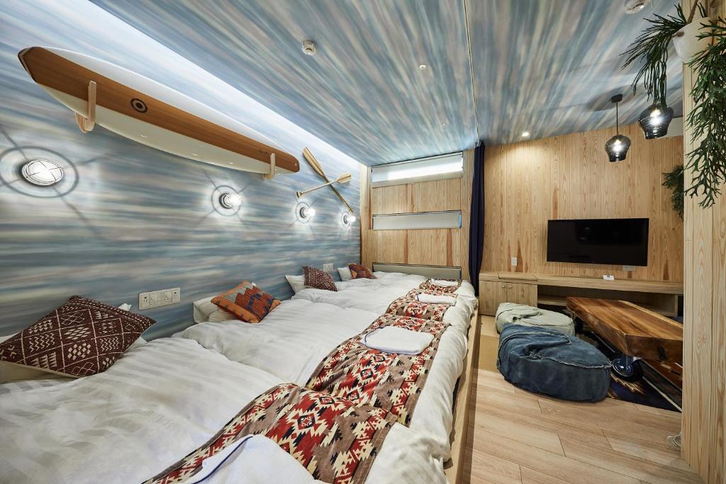 Postel nebo postele na pokoji v ubytování Hotel TORACO konohana