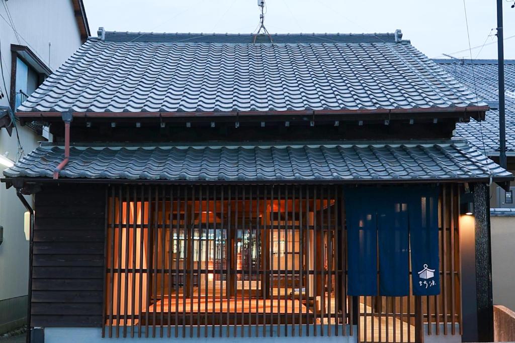 a building with barred windows and a roof at Machihaku 456 in Shizuoka