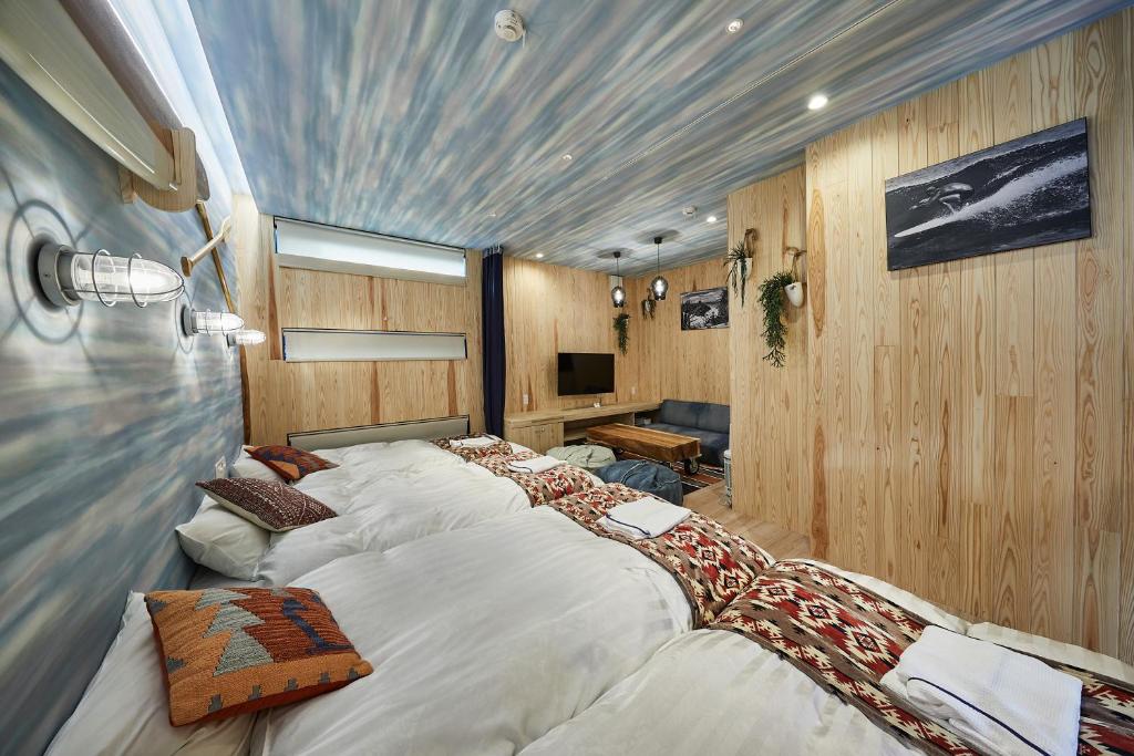 Postel nebo postele na pokoji v ubytování Hotel TORACO konohana