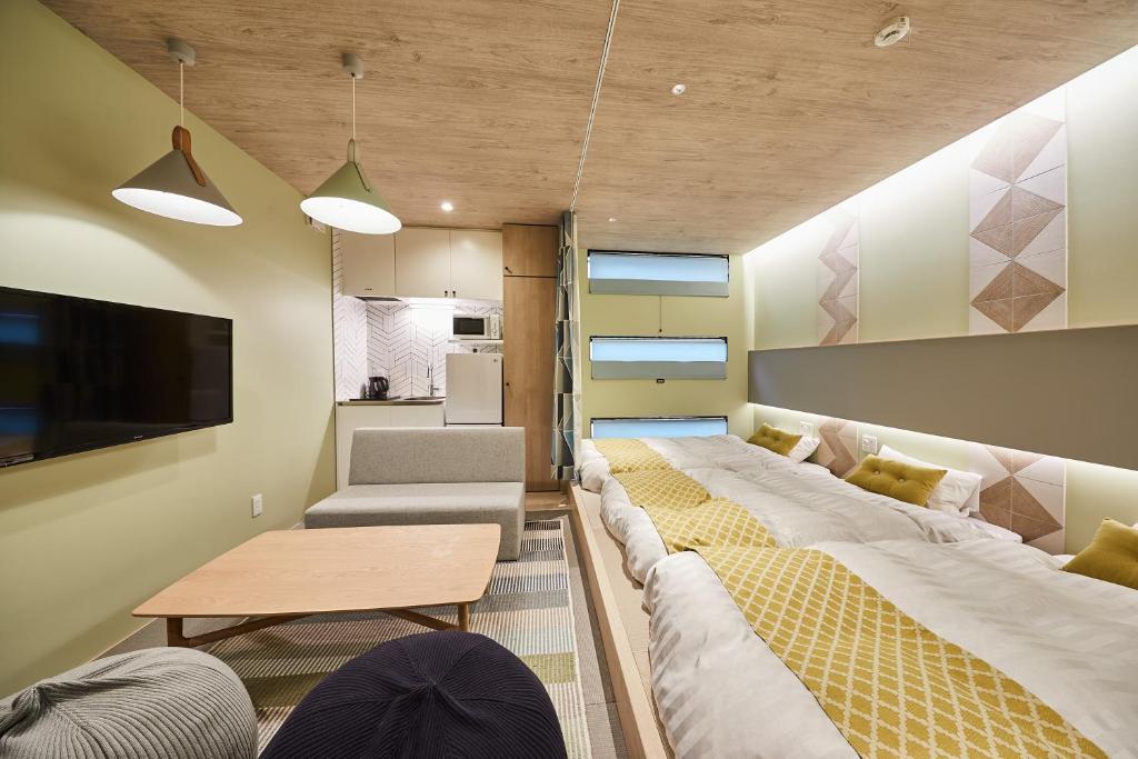Postel nebo postele na pokoji v ubytování Hotel TORACO konohana