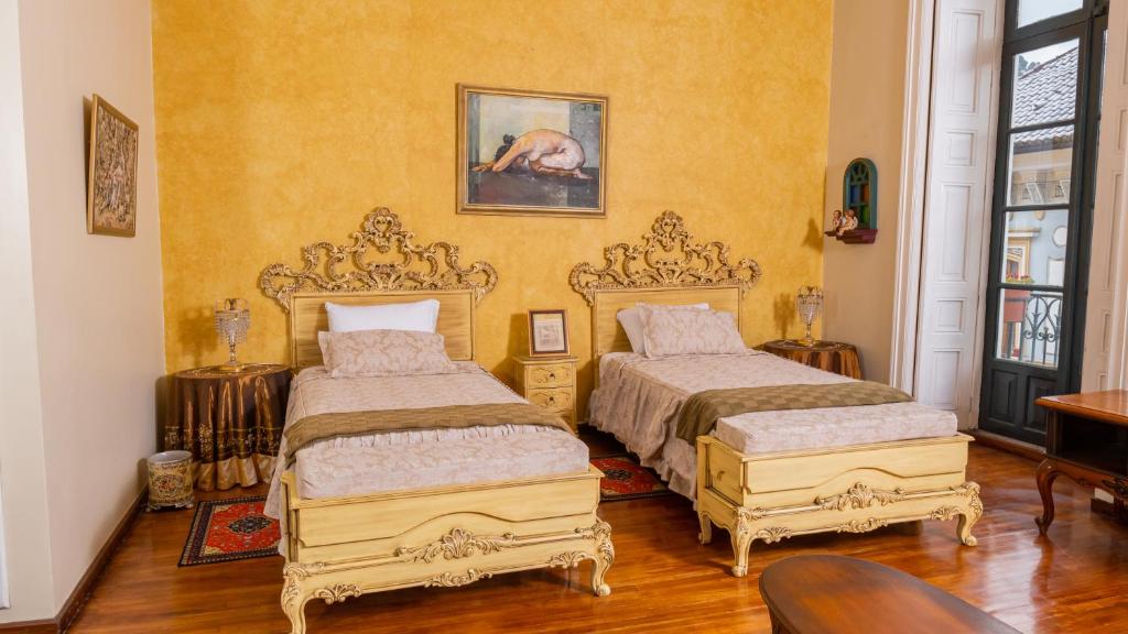 Postel nebo postele na pokoji v ubytování Casa Colonial Quito