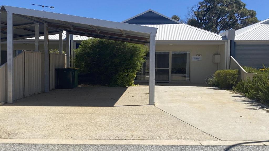 a house with a covered driveway in front of it at Unit 66 Seafront Estate in Jurien Bay