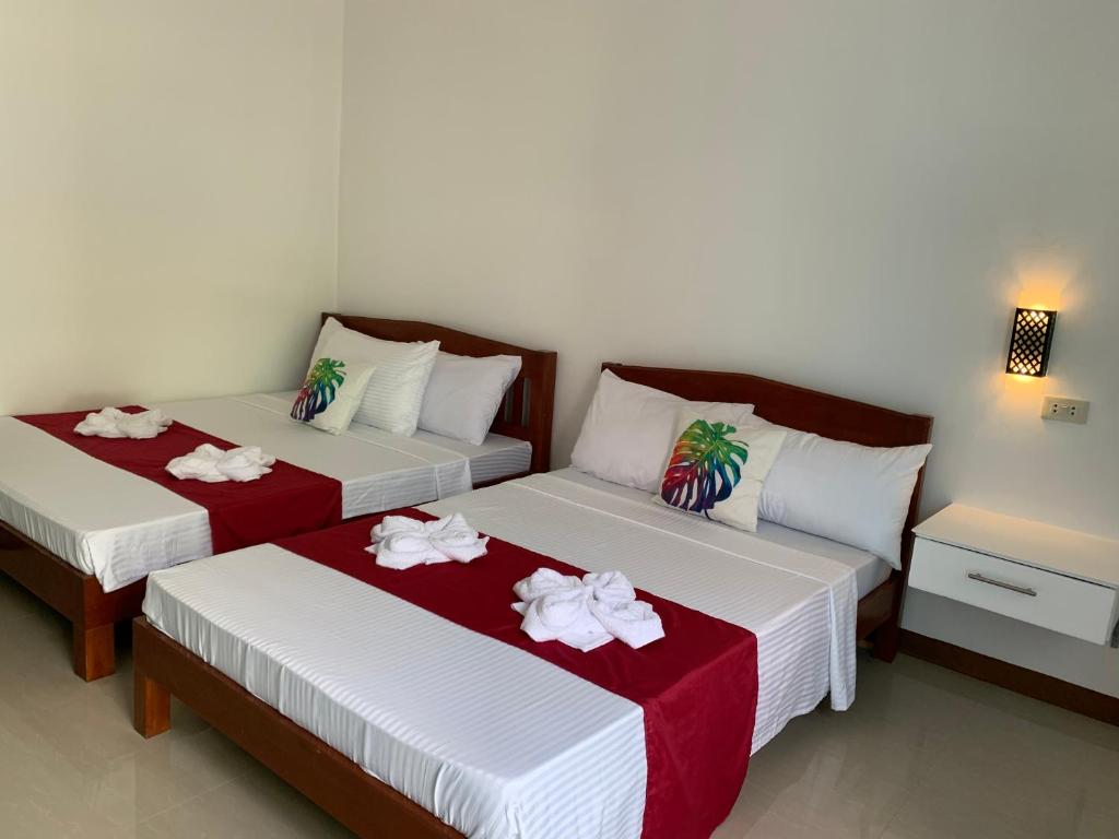 Postel nebo postele na pokoji v ubytování Sunshine Stay Panglao
