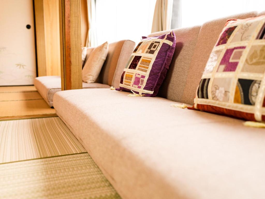 Postel nebo postele na pokoji v ubytování Kokoyui Guest House