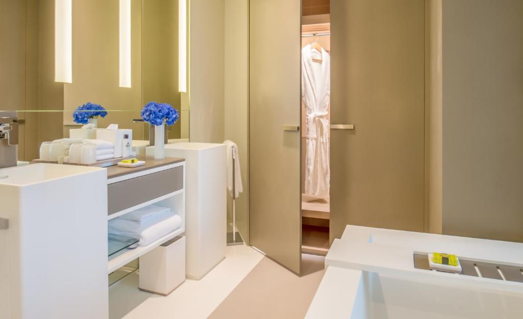 a bathroom with a white sink and a mirror at InterContinental Dubai Marina by IHG in Dubai