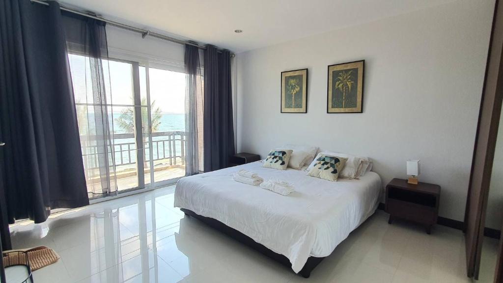 Postel nebo postele na pokoji v ubytování W Sea beach Rayong