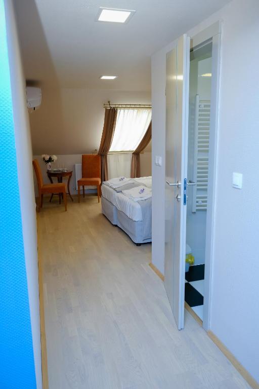 Postel nebo postele na pokoji v ubytování Barkóscinege Vendégház