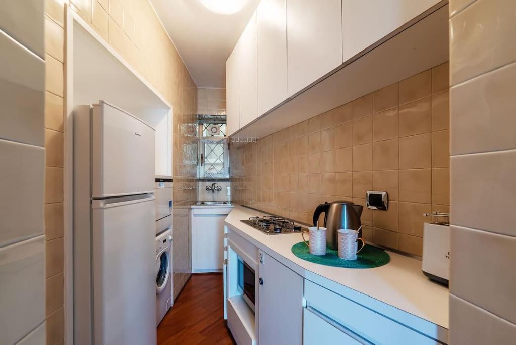 A kitchen or kitchenette at HospitalityRome Piazza di Spagna View