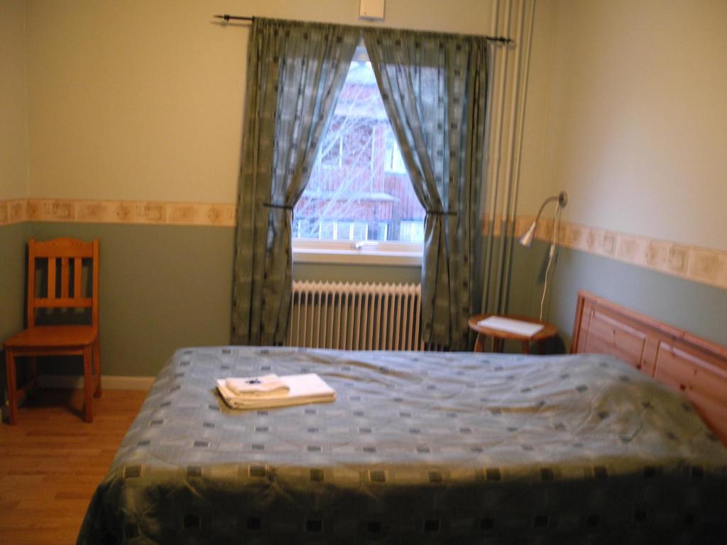 Postel nebo postele na pokoji v ubytování Målilla Hotell & Restaurang