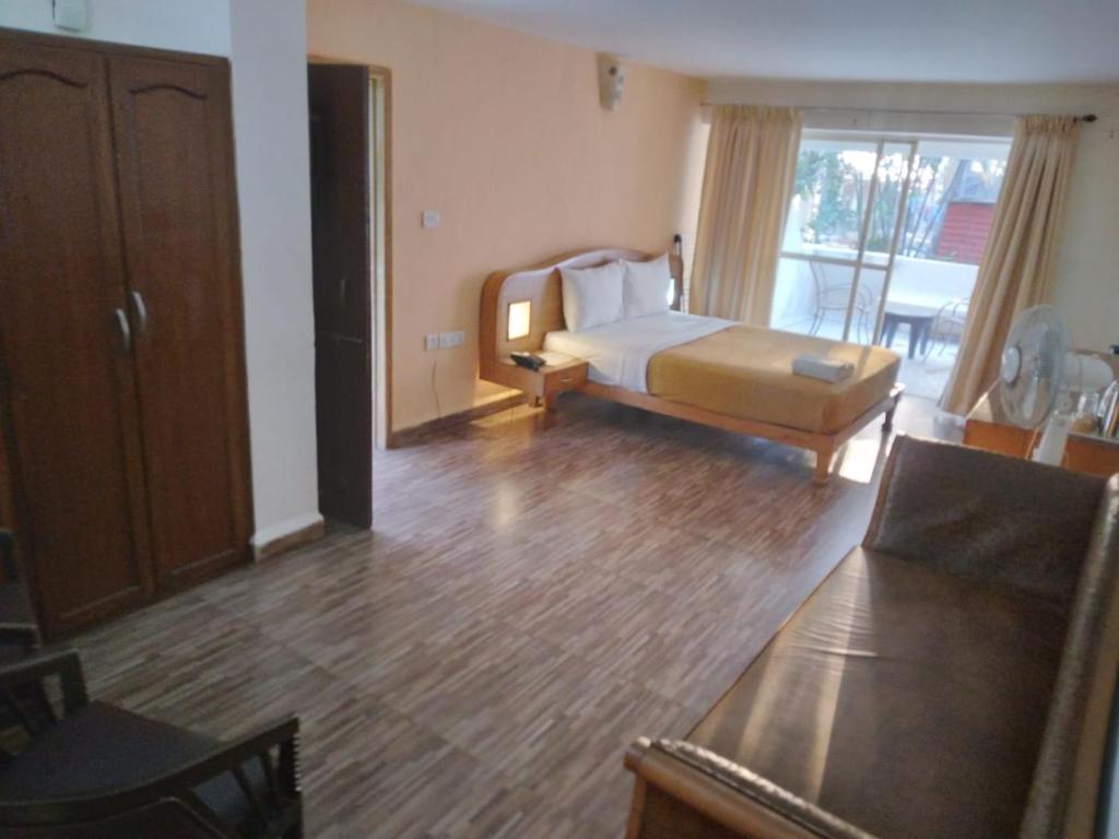 Postel nebo postele na pokoji v ubytování Calangute Residency