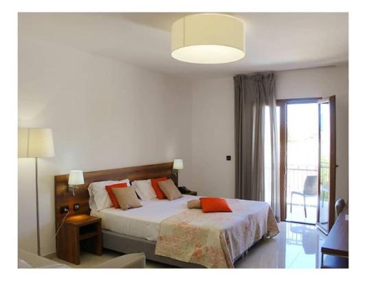 Postel nebo postele na pokoji v ubytování Morello Beach Hotel