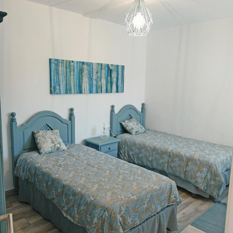 A bed or beds in a room at Apartamentos La casa del Zapatero