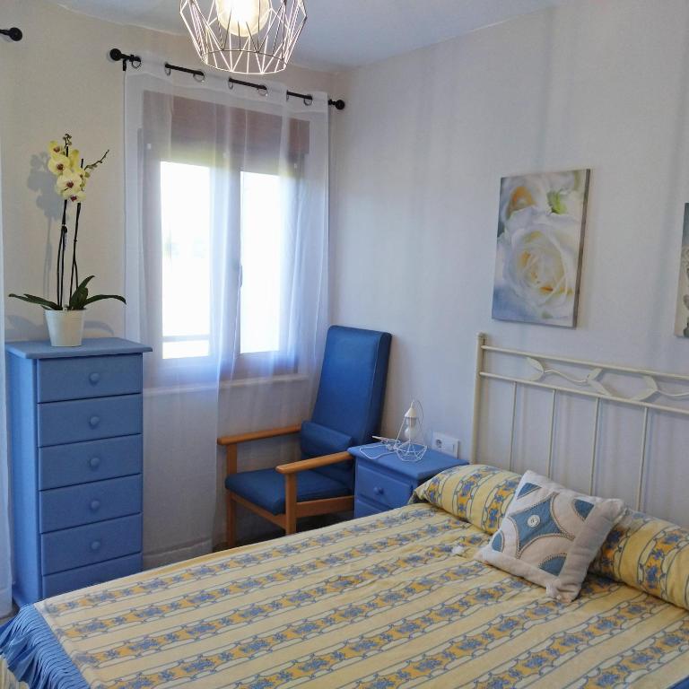 A bed or beds in a room at Apartamentos La casa del Zapatero