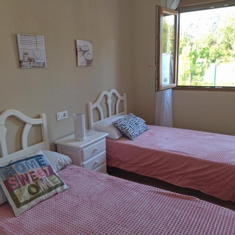 A bed or beds in a room at Apartamentos La casa del Zapatero