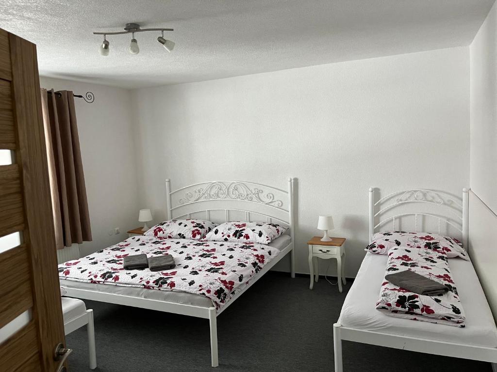 Letto o letti in una camera di A&A Apartmany