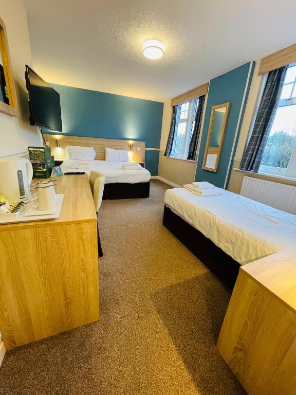 Кровать или кровати в номере North Shore Hotel