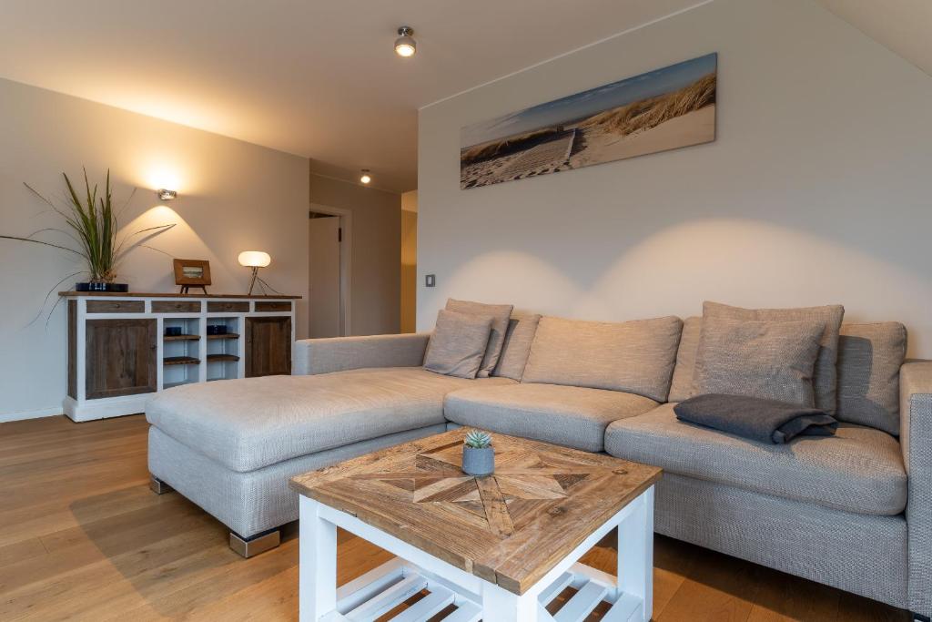 Posezení v ubytování Ferienhaus Kirchenstraße Appartement Achtern Diek OG