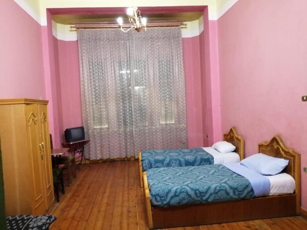 Postel nebo postele na pokoji v ubytování Berlin Hotel