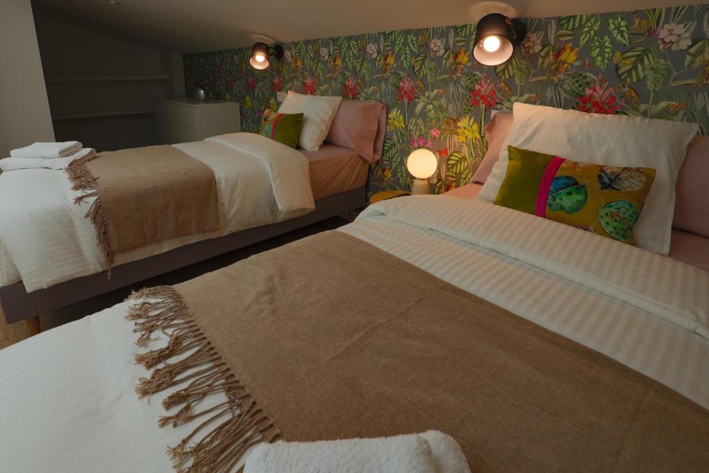 Postel nebo postele na pokoji v ubytování APARTAMENTOS LOS QUESEROS