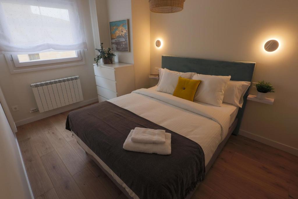 Postel nebo postele na pokoji v ubytování APARTAMENTOS LOS QUESEROS