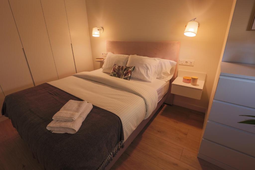 Postel nebo postele na pokoji v ubytování APARTAMENTOS LOS QUESEROS