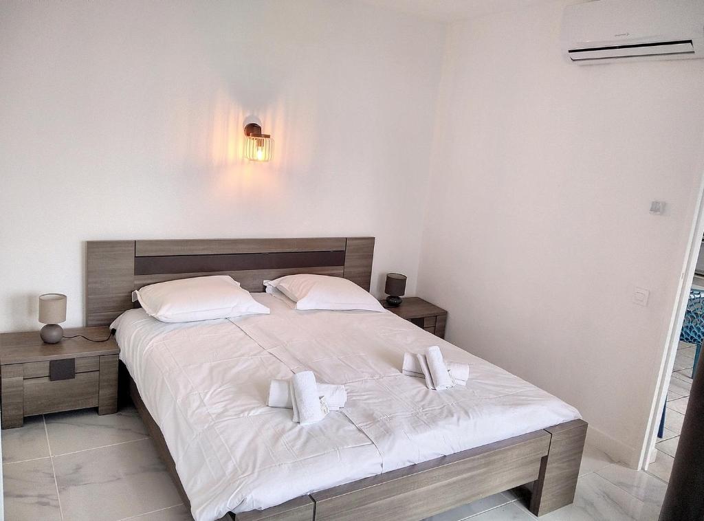 Posteľ alebo postele v izbe v ubytovaní Résidence Graziella Appartement 422