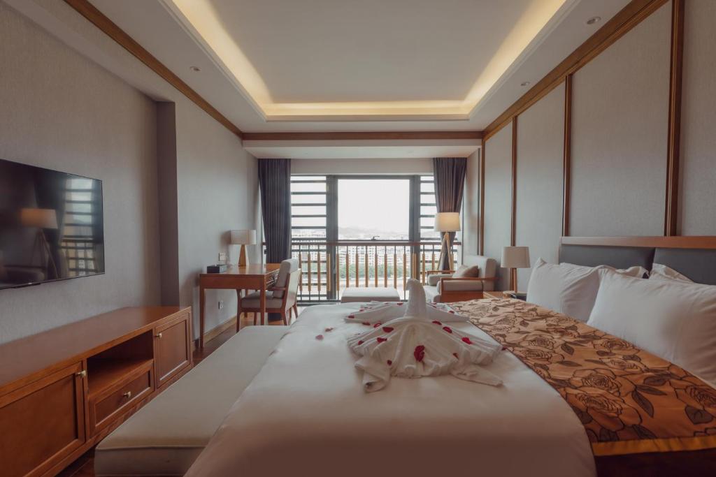 Postel nebo postele na pokoji v ubytování White Swan Guest House MeiZhou