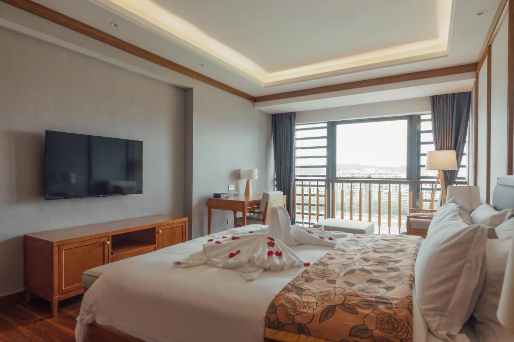 Postel nebo postele na pokoji v ubytování White Swan Guest House MeiZhou