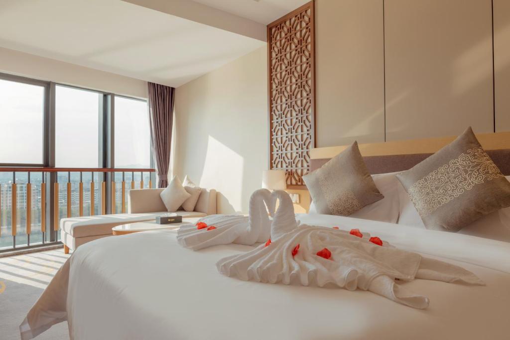 Postel nebo postele na pokoji v ubytování White Swan Guest House MeiZhou