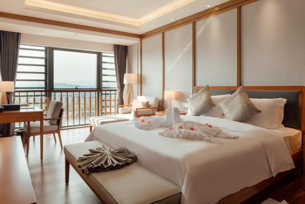 Postel nebo postele na pokoji v ubytování White Swan Guest House MeiZhou