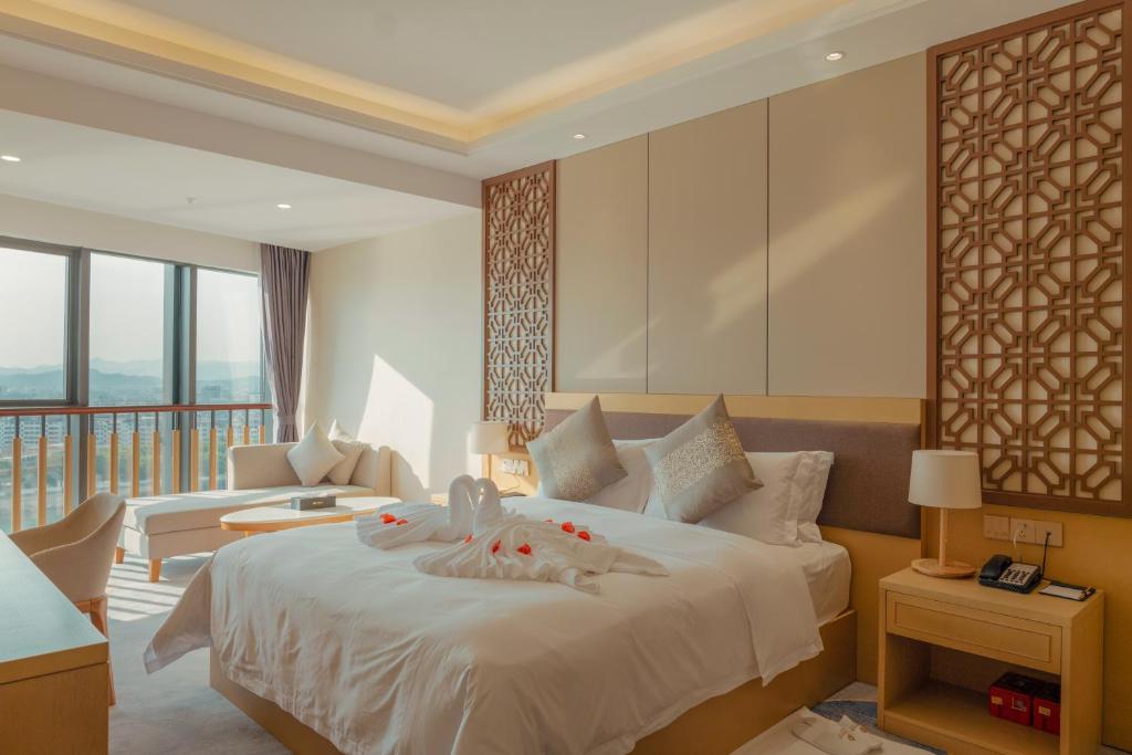 Postel nebo postele na pokoji v ubytování White Swan Guest House MeiZhou