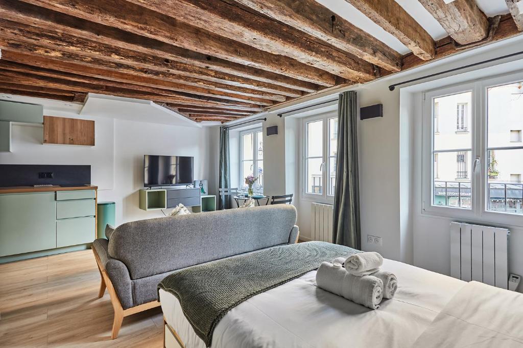 Posteľ alebo postele v izbe v ubytovaní Residence Center of Paris by Studio prestige