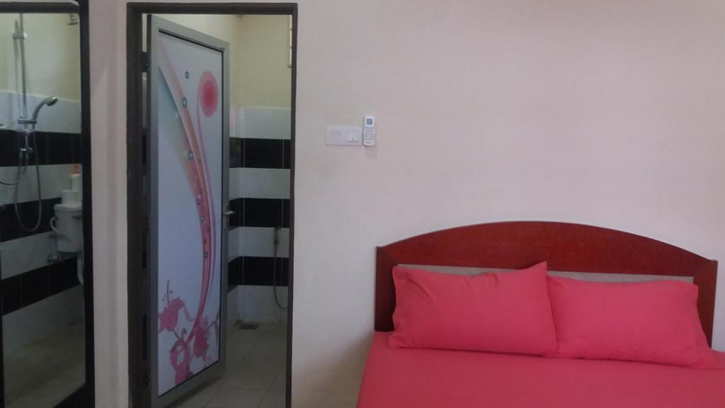 Postel nebo postele na pokoji v ubytování GLG KLIA Transit House