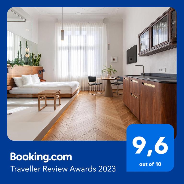 a hotel room with a bed and a kitchen at Wyspa 12 in Poznań