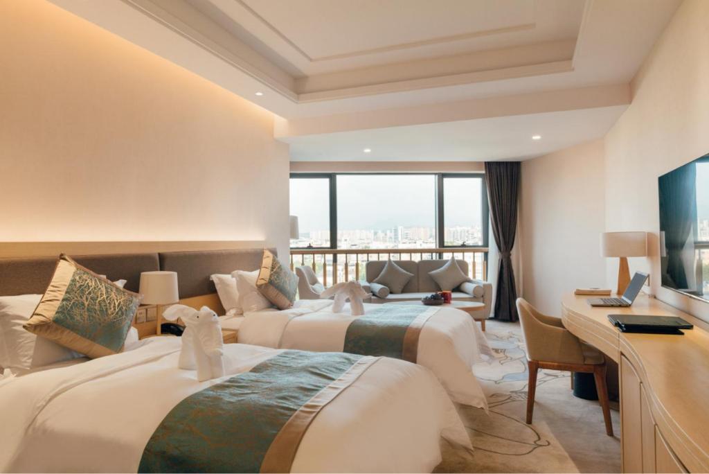 Postel nebo postele na pokoji v ubytování White Swan Guest House MeiZhou